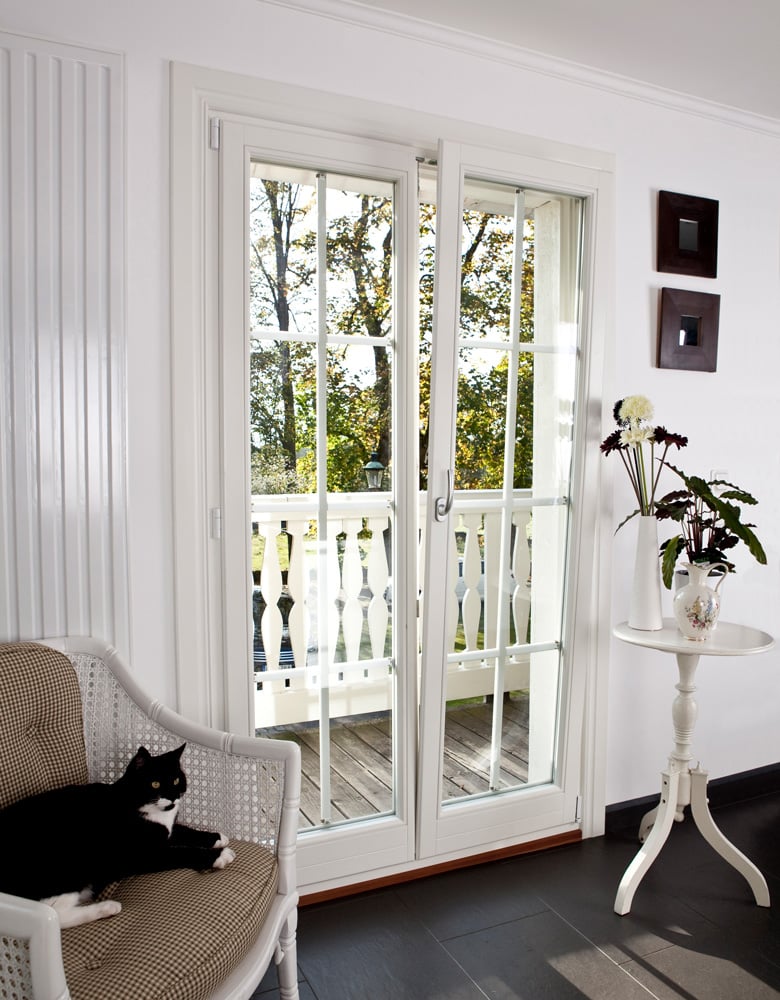 Inward-opening French door with removable astragals in tilt position