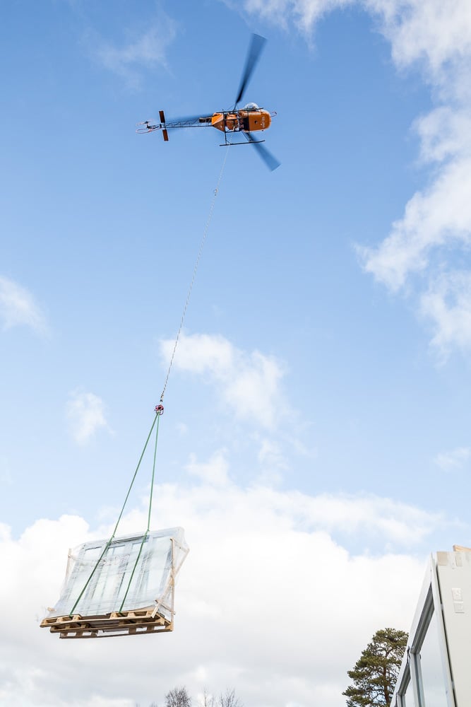 Delivery of windows by helicopter